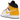Air Jordan 1 Mid University Gold sneakers i vinklet profil med hvid læderbase, gule overlag og ikonisk sort Nike Swoosh på siden
