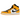 Air Jordan 1 Mid Taxi sneakers set fra siden med gul læderoverdel, hvide sidepaneler og en sort Nike Swoosh samt klassisk Jordan Wings-logo.