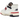 New Balance 550 Aime Leon Dore White Navy Red sneakers i vinklet profil med hvid læderoverdel, navyblå logo og rød detalje på ydersålen