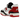 New Balance 550 White Red Black sneakers i sideprofil med hvid læderoverdel, sorte detaljer og rød New Balance-branding på siden