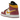 Air Jordan 1 Mid Dia de los Muertos sneakers i en vinklet visning med hvide læderdetaljer, guld-Swoosh og iøjnefaldende mønstret kantdetaljer.