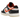 Nike Dunk Low PRM Halloween sneakers i en skrå vinkel med sort og hvidt læderdesign, orange swoosh-detaljer og matchende orange ydersål