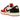 Air Jordan 1 Retro Low OG Trophy Room Rookie Card Away sneakers i en flot sideprofil med hvide læderpaneler, rød Swoosh og guld detaljer.
