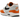 Nike Air Max 1 Monarch sneakers i vinklet visning med hvid overdel, orange læderdetaljer, synlig Air-enhed og robust hvid sål.