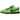 Nike SB Dunk Low The Powerpuff Girls Buttercup sneakers i en vinklet visning med grøn ruskindsoverdel, sorte snørebånd og karakteristiske store øjne på hælen.