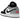 Air Jordan 1 Low SE Panda Toe sneakers set fra siden med hvid læderbase, sorte overlejringer ved tåen og et ikonisk hvidt Jumpman-logo på pløsen